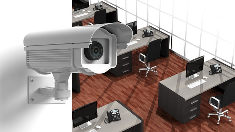 Surveillance camera in the office on the wall